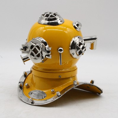 Lot 69 - A reproduction miniature model divers helmet,...