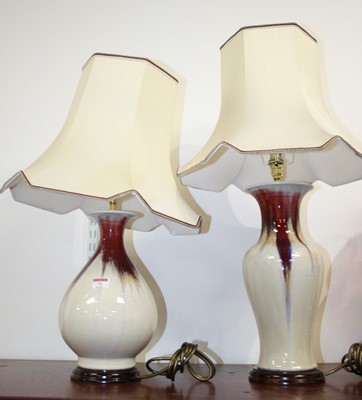 Lot 71 - A contemporary table lamp, on a red and white...