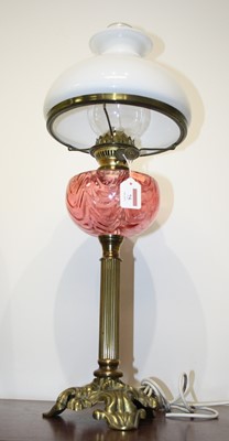 Lot 75 - An early 20th century brass pedestal oil lamp,...