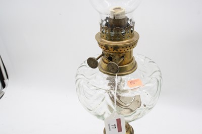 Lot 77 - An early 20th century brass pedestal oil lamp,...