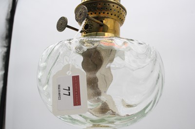 Lot 77 - An early 20th century brass pedestal oil lamp,...