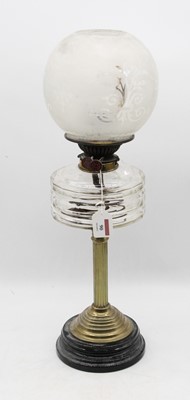 Lot 90 - An early 20th century brass pedestal oil lamp,...