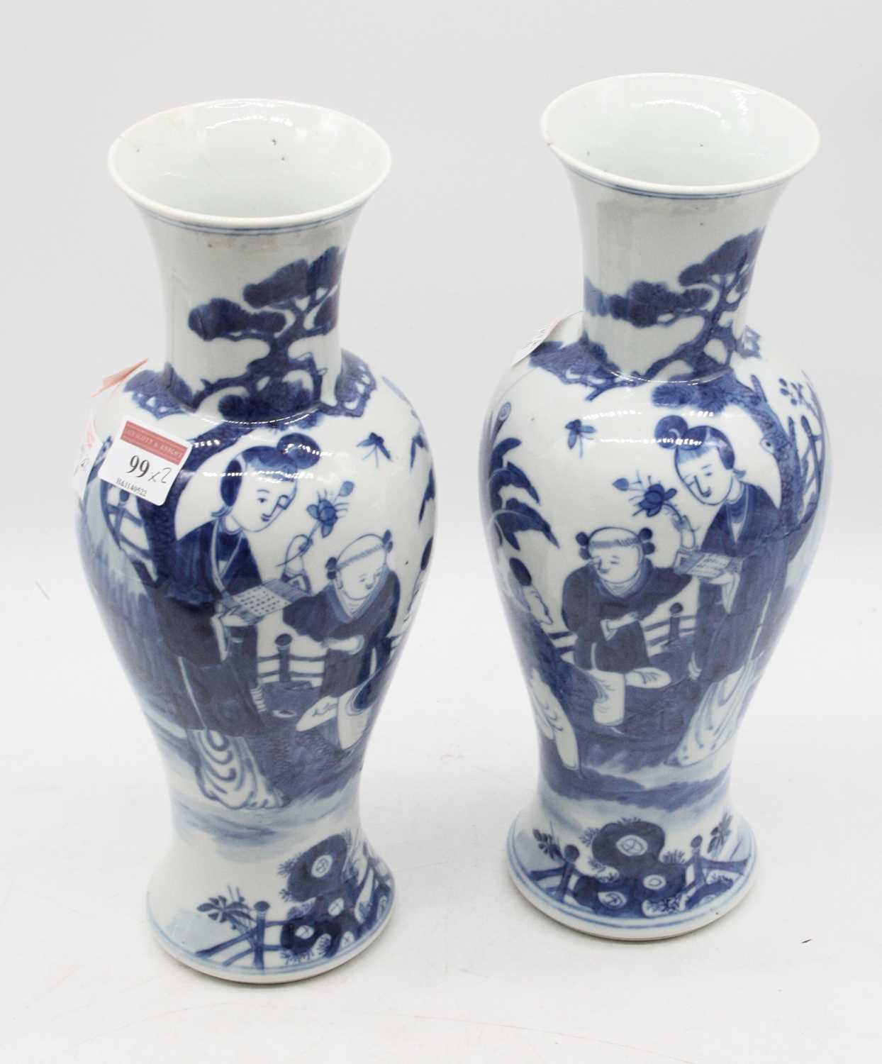Lot 99 - A pair of Chinese export blue and white vases,...