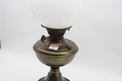 Lot 126 - An early 20th century brass pedestal oil lamp,...