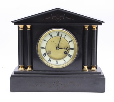 Lot 138 - A late Victorian black slate mantel clock, of...