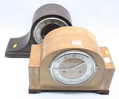 Lot 150 - A 1950s oak cased mantel clock, having a...