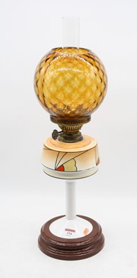 Lot 154 - A 1930s oil lamp, having an orange tinted...