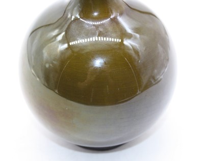 Lot 185 - A 20th century green glazed bottle vase, h.28cm