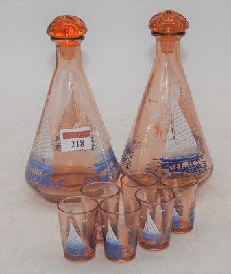 Lot 218 - A 1950s pink tinted glass drinks set,...