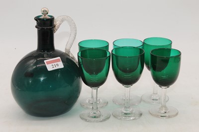 Lot 219 - An early 20th century green glass drinks set,...