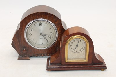 Lot 220 - A 1920s oak mantel clock, height 15cm,...