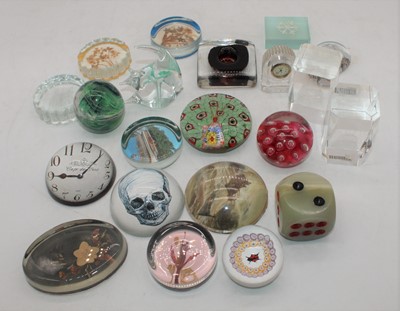 Lot 221 - A collection of glass paperweights, to include...