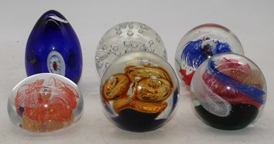 Lot 244 - A collection of six various glass paperweights