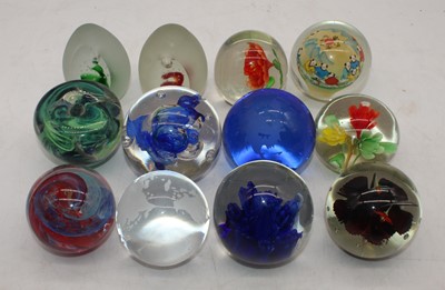 Lot 247 - A collection of 12 various glass paperweights