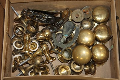 Lot 278 - A box of brasswares, to include door furniture,...