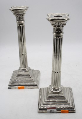 Lot 268 - A pair of silver plated table candlesticks,...