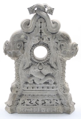 Lot 114 - A large ornately carved stone clock case, the...