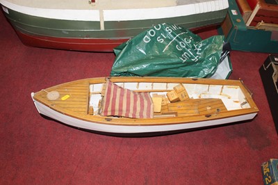 Lot 549 - A fibreglass model ships hull, together with...