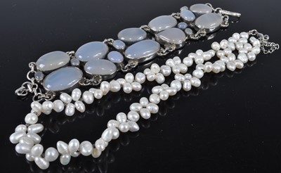 Lot 318 - A white metal and moonstone set bracelet;...