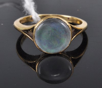 Lot 343 - A yellow metal and cabochon opal set ring,...