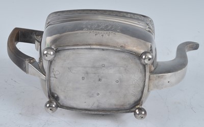 Lot 1066 - A George III silver teapot, of shaped...