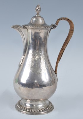 Lot 1068 - A George III silver hot water pot, of baluster...