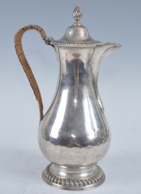 Lot 1068 - A George III silver hot water pot, of baluster...