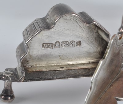 Lot 1064 - A pair of George III silver wick scissors,...