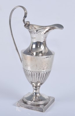 Lot 1097 - An Edwardian silver miniature ewer, of...