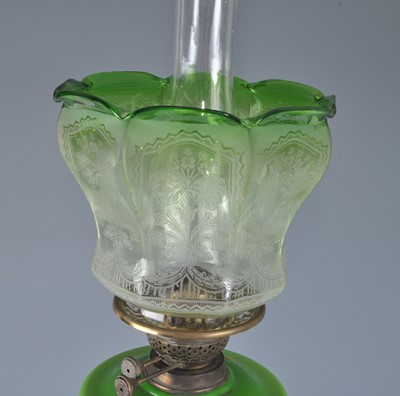 Lot 1255 - A Victorian brass oil lamp, having an acid...
