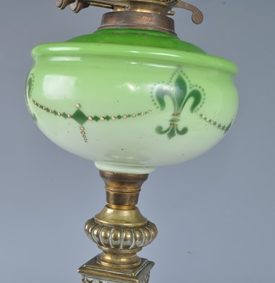 Lot 1255 - A Victorian brass oil lamp, having an acid...