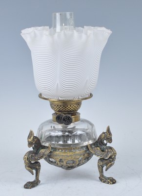Lot 1256 - A Victorian brass oil lamp, having a white and...