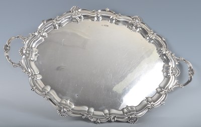 Lot 1101 - An Edwardian silver twin handled drinks tray,...