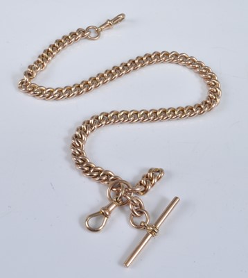 Lot 1221 - A 9ct gold curblink watch chain with T bar and...