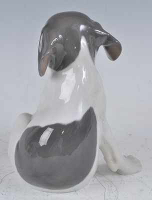 Lot 70 - A Royal Copenhagen model of a seated puppy dog,...