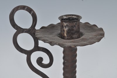Lot 274 - An Arts & Crafts patinated metal candlestick,...