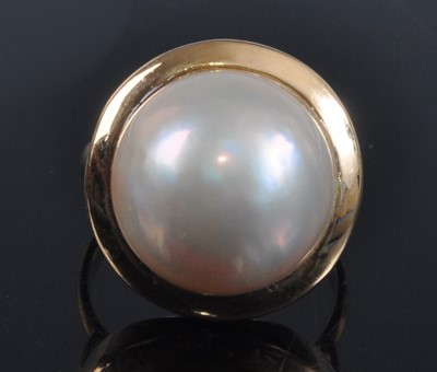 Lot 1148 - A yellow metal pearl dress ring, featuring a...