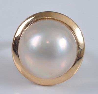 Lot 1148 - A yellow metal pearl dress ring, featuring a...