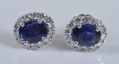Lot 1149 - A pair of white metal, sapphire and diamond...