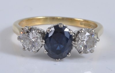Lot 1155 - An 18ct yellow and white gold, sapphire and...