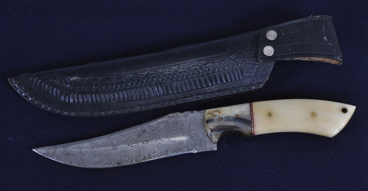 Lot 330 - A hunting knife, having a 15cm Damascus Bowie...