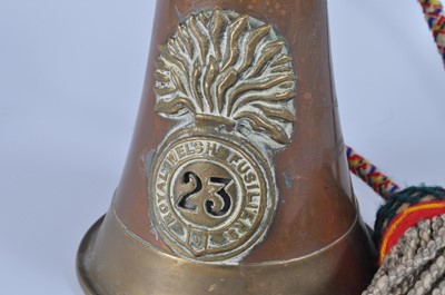 Lot 62 - A copper and brass bugle with applied badge...