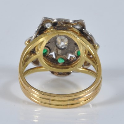 Lot 1158 - A yellow and white metal, emerald and diamond...