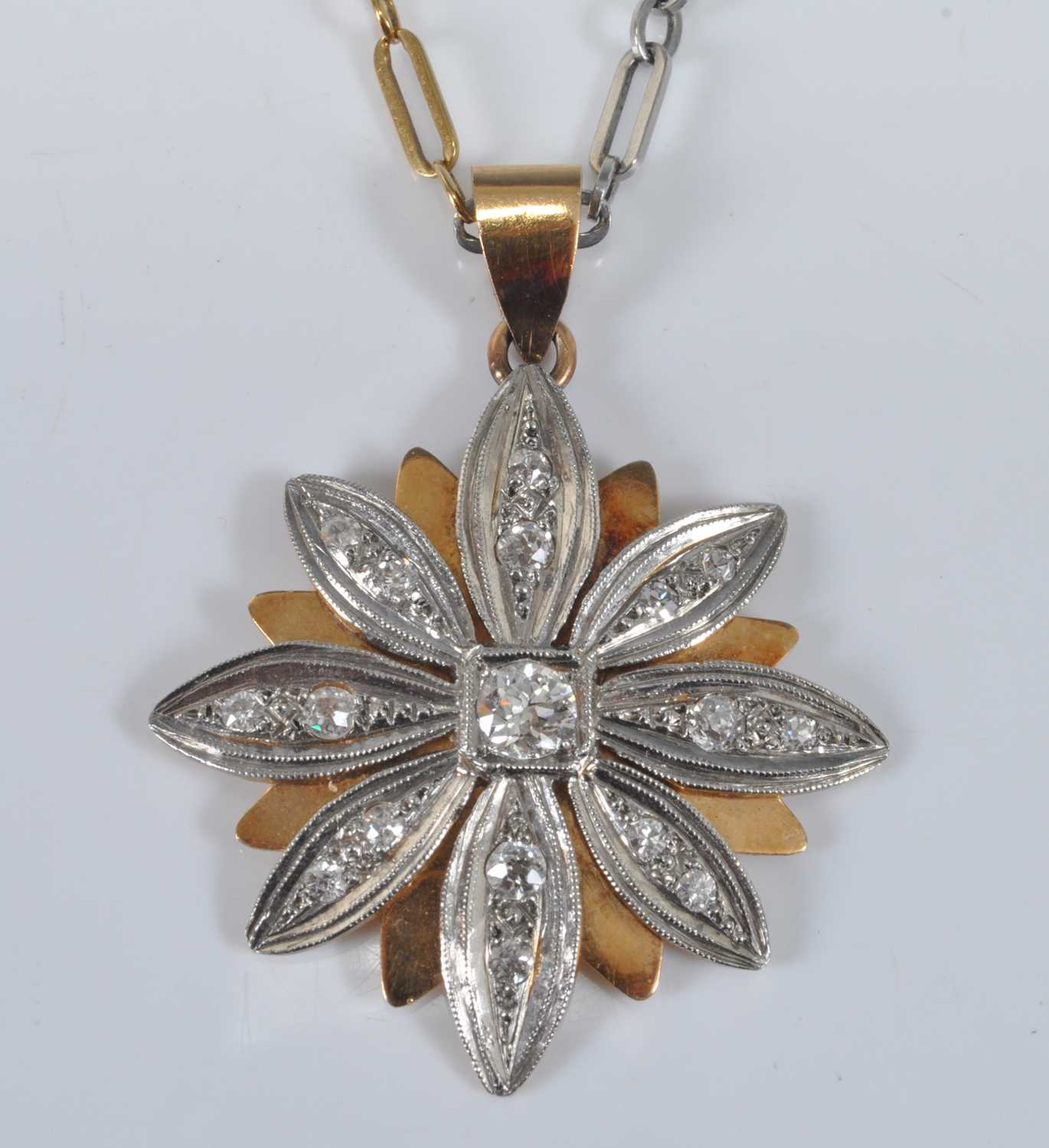 Lot 1163 - A yellow and white metal diamond flower...