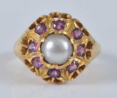 Lot 1147 - A yellow metal, pearl and ruby heavy circular...