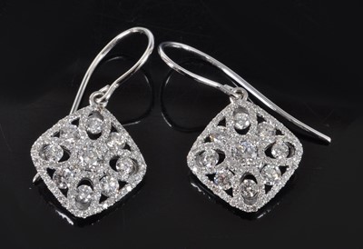 Lot 1166 - A pair of white metal diamond off-square...