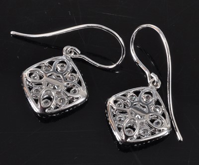 Lot 1166 - A pair of white metal diamond off-square...