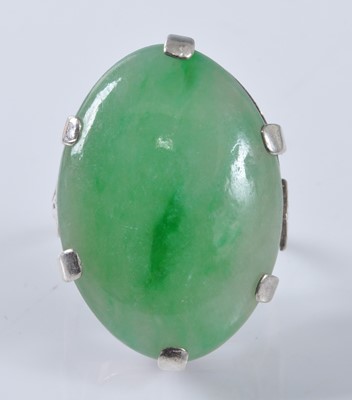 Lot 1177 - A white metal jadeite dress ring, featuring an...