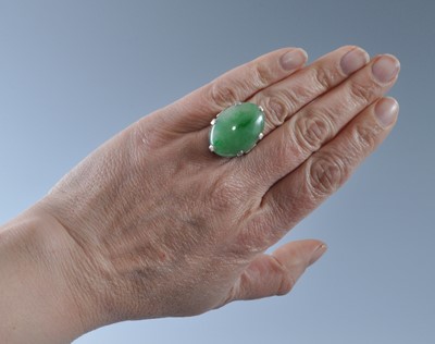 Lot 1177 - A white metal jadeite dress ring, featuring an...