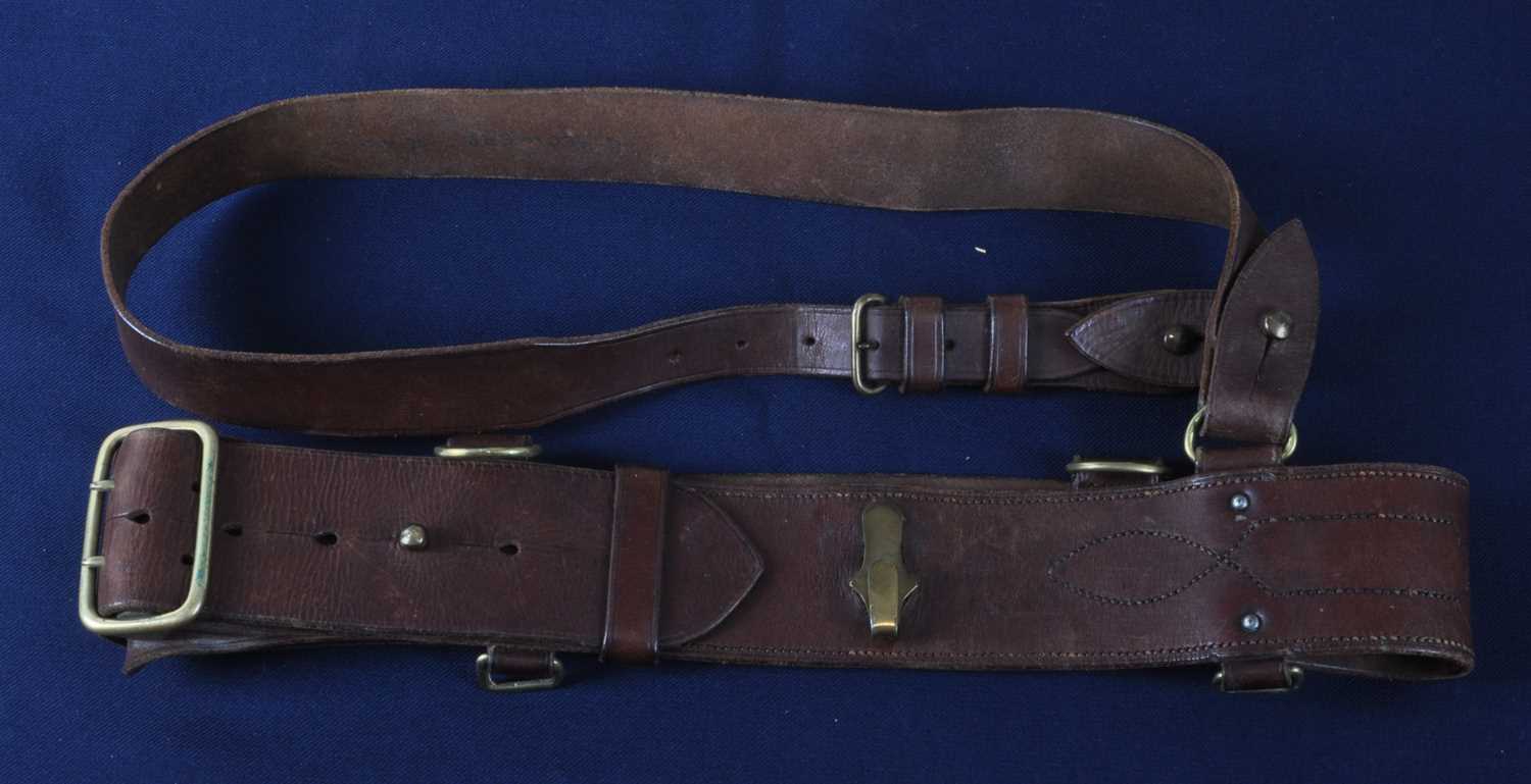 Lot 66 - A brown leather Sam Browne belt, with brass...